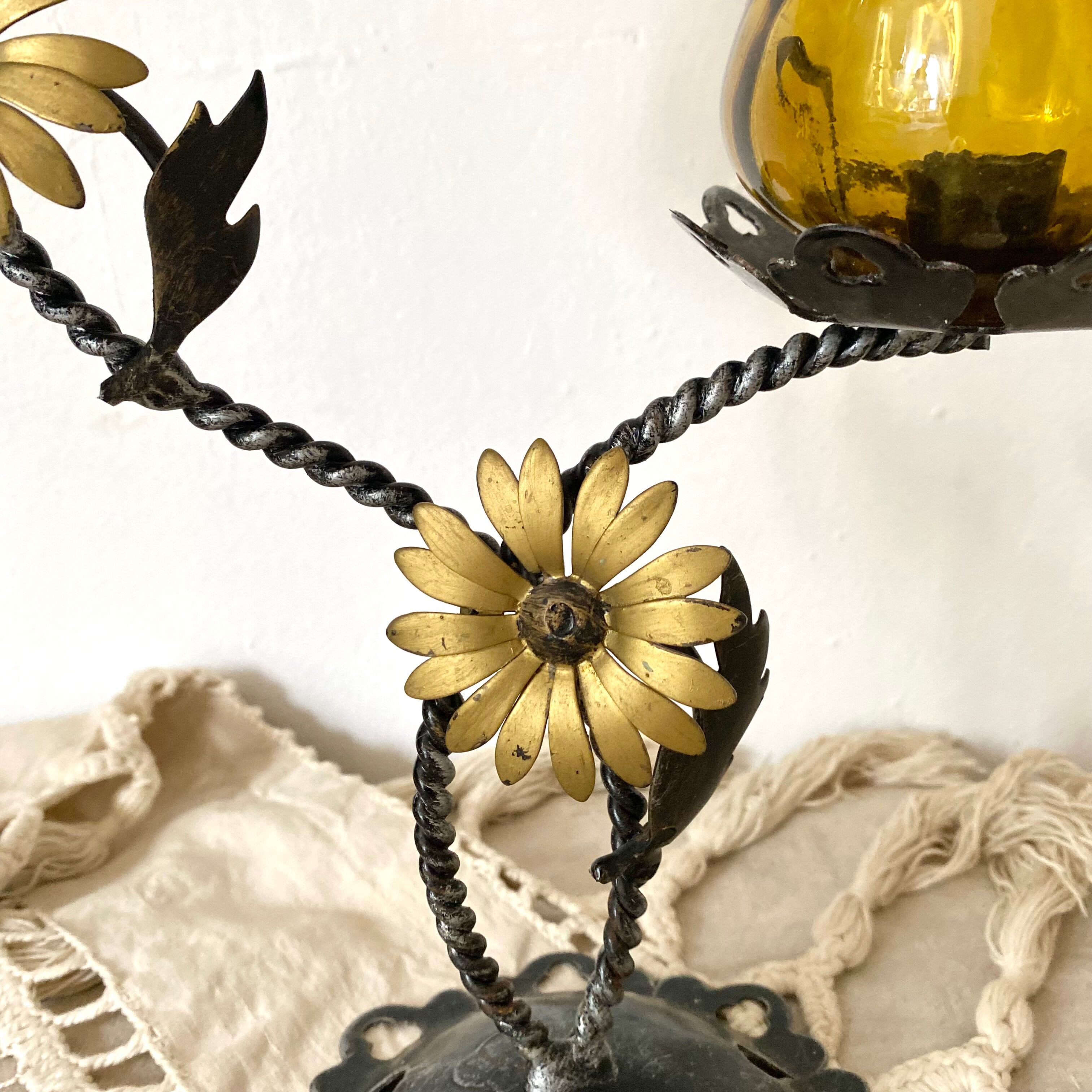 Double candle holder in metal and amber glass