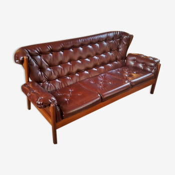 Scandinavian couch in the 60s in teak and skai