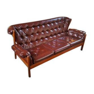 Scandinavian couch in the 60s in teak and skai