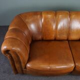 Sheepskin sofa with decorative nails