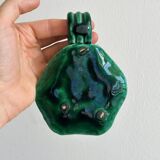 Antique green enamelled ceramic candle holder