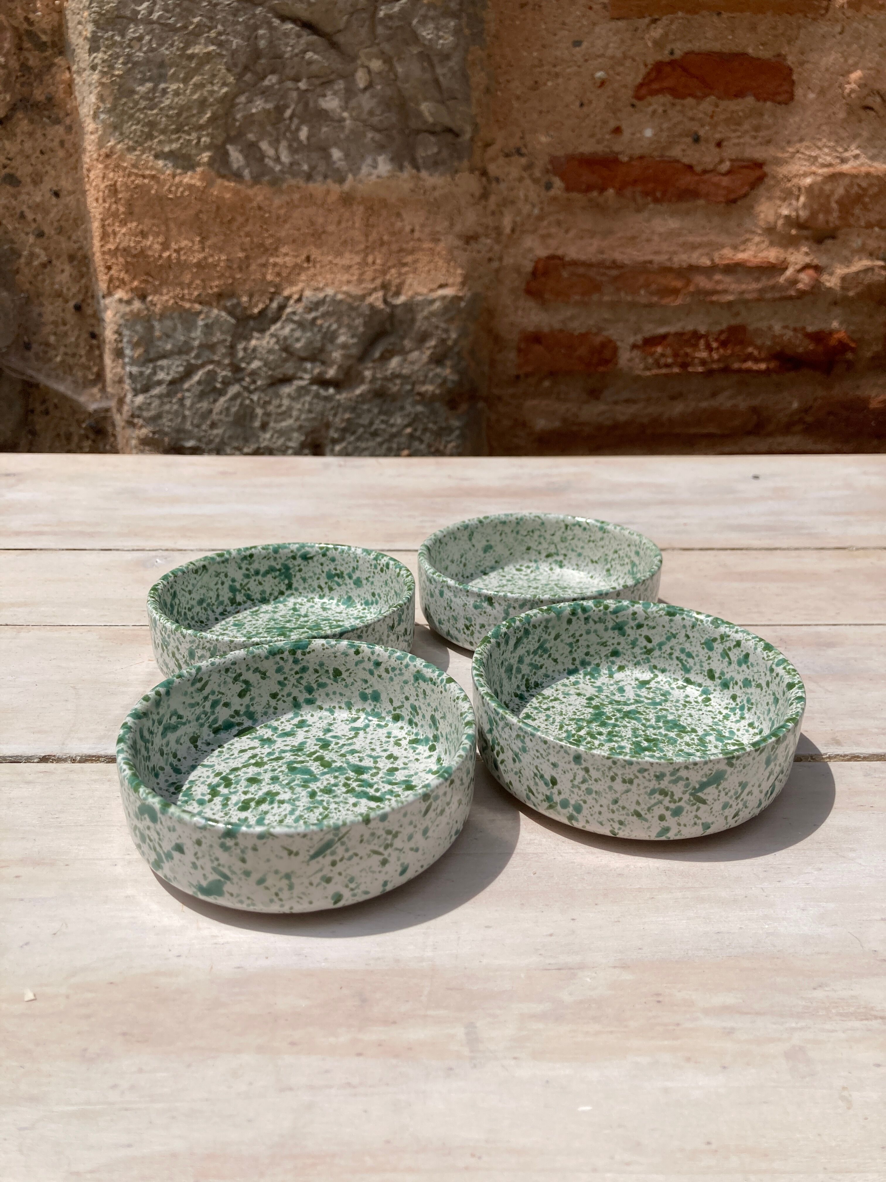 Four spotted green ramekins