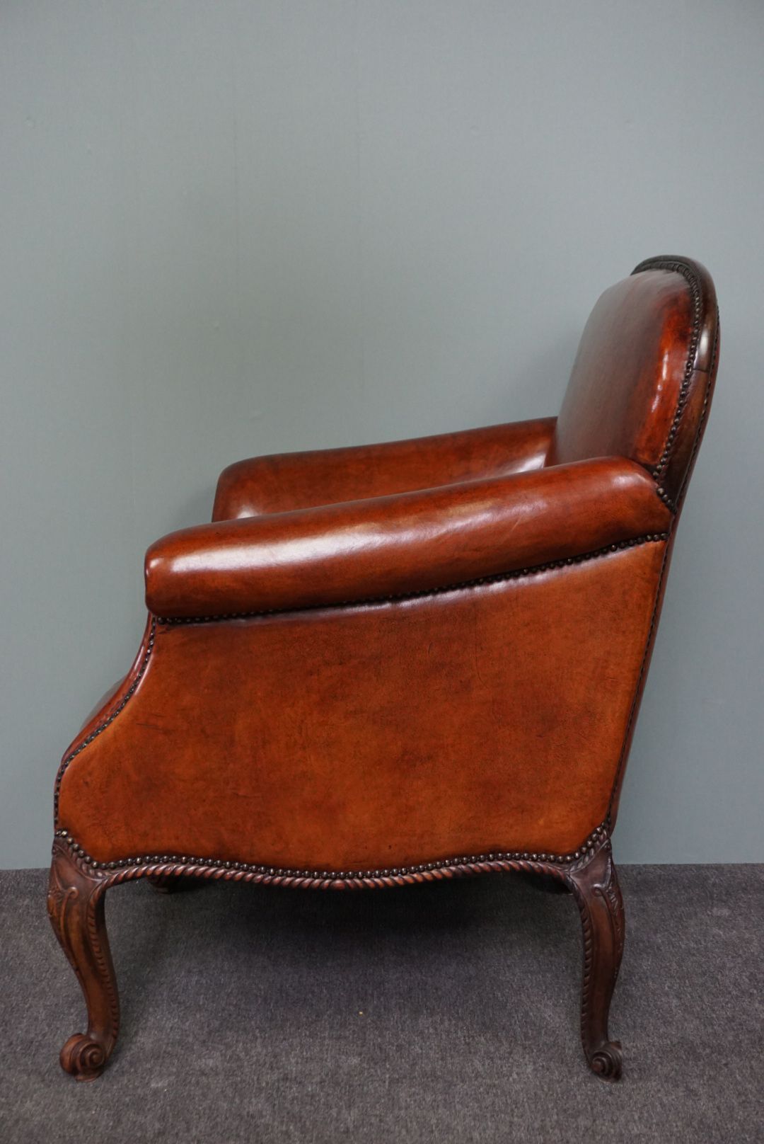 Old armchair in sheep leather
