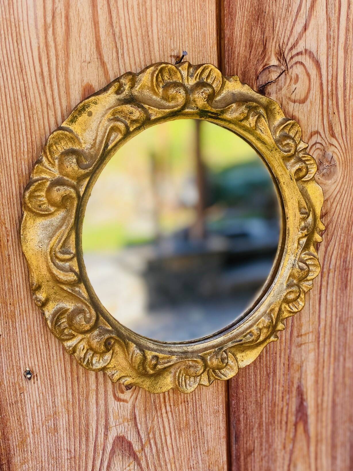 Small round antique gold mirror