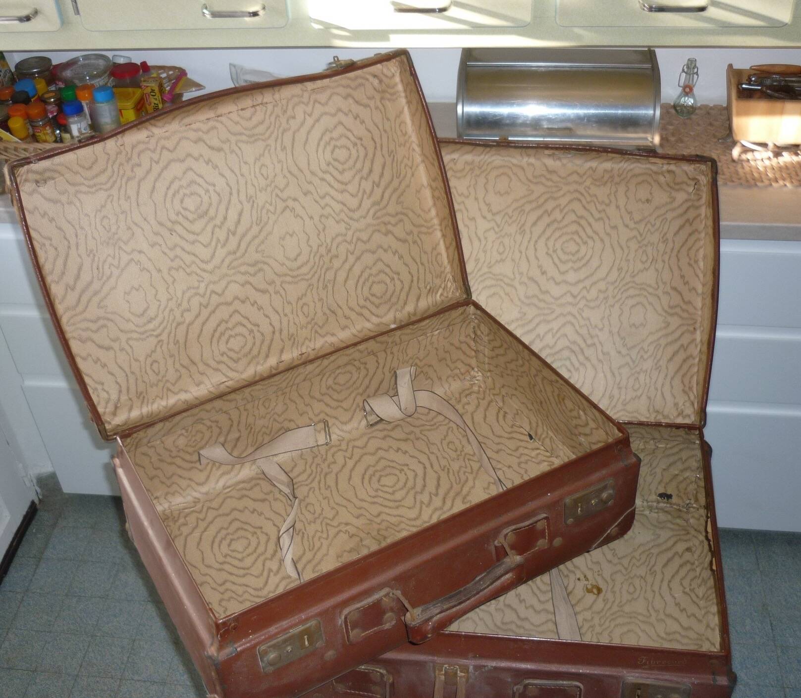 Pair of red suitcases from the 1950s