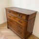 Antique solid wood chest of drawers with four drawers.
