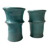 Two lovely turquoise ceramic mug vases.