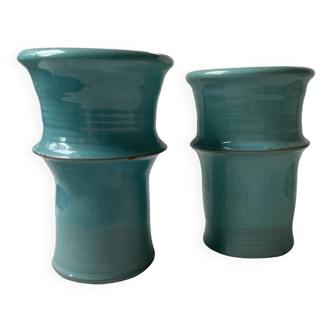 Two lovely turquoise ceramic mug vases.