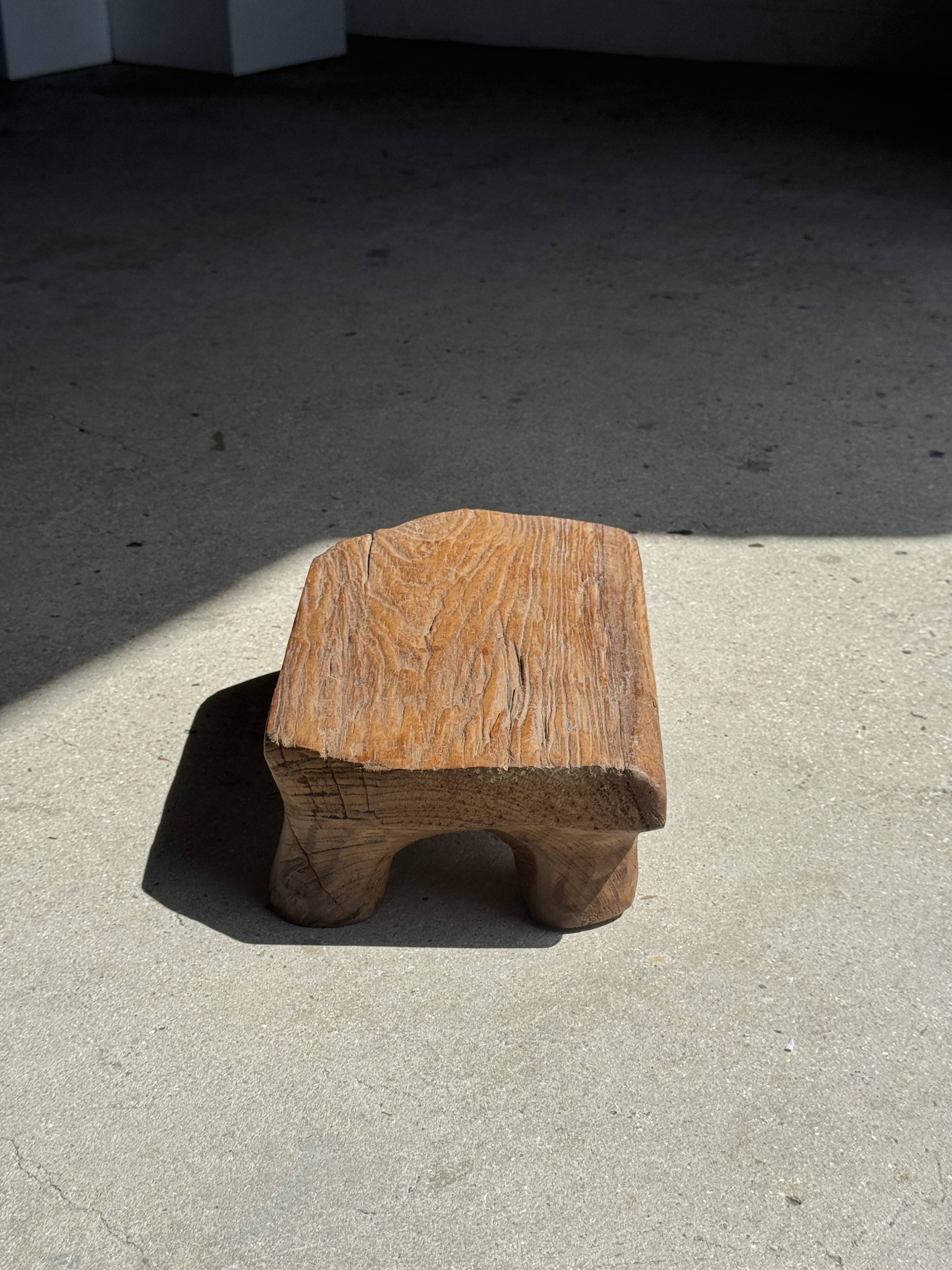 Small stool, teak footrest with short cut corners.