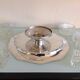 Servant of table on foot shower in silver metal art deco style