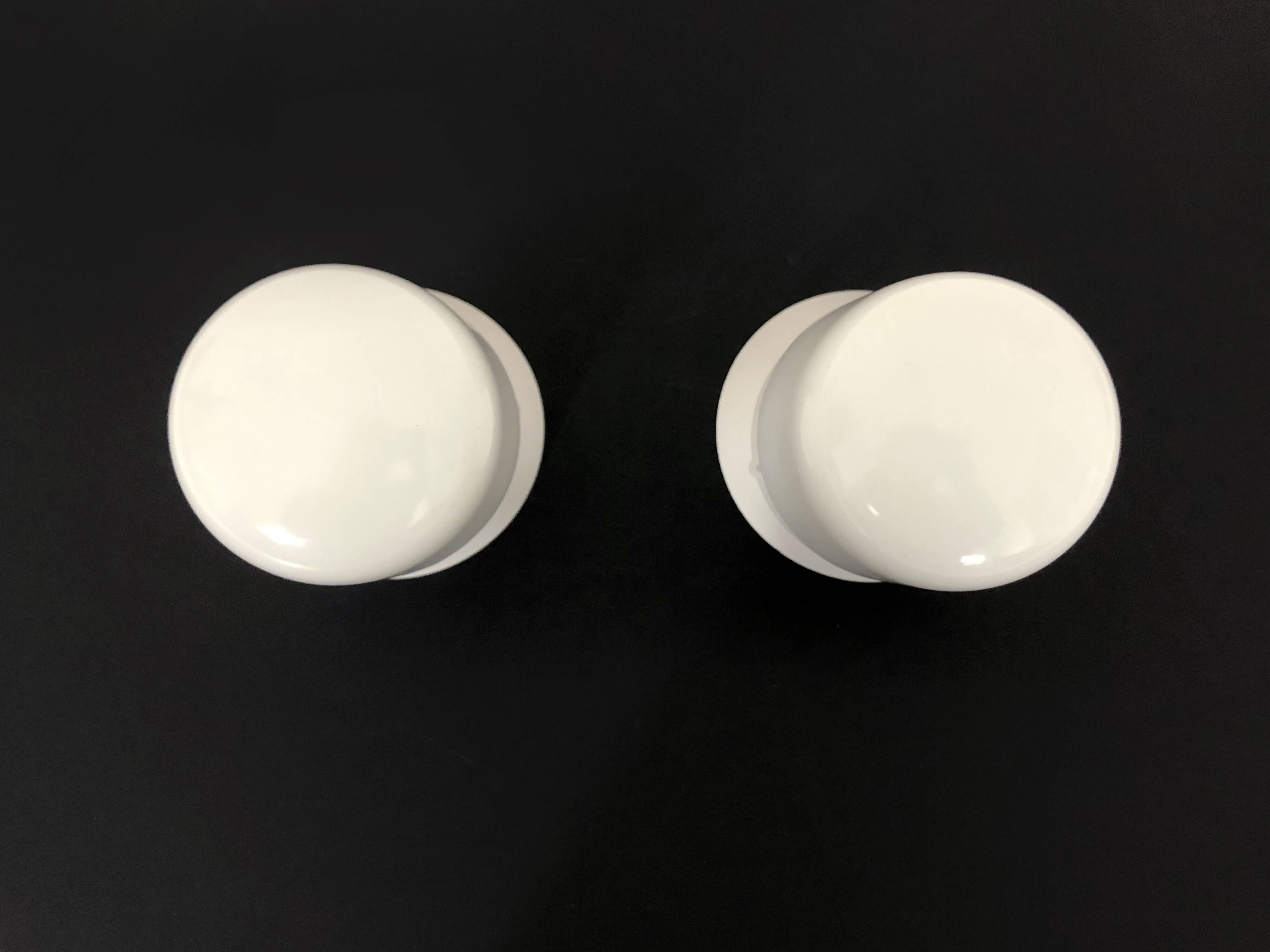 Pair of white oblique wall lights by Arno. 60s