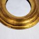 Golden oval mirror