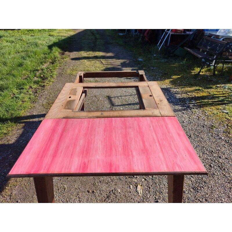 1960s oak dining table with integrated extensions.