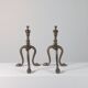 Paire de chenets en laiton au design zoomorphe vintage.