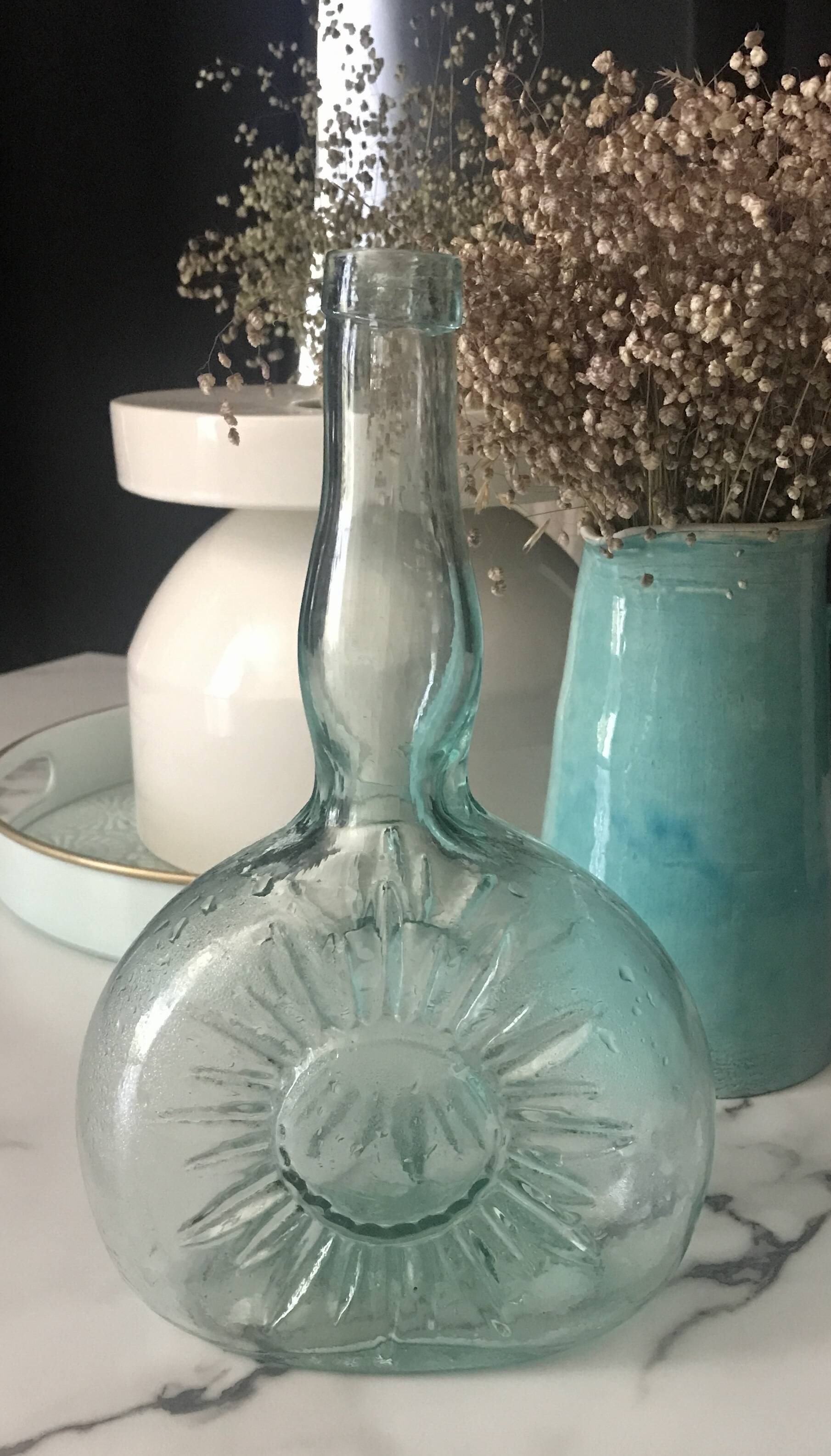 Bouteille vintage embossage soleil