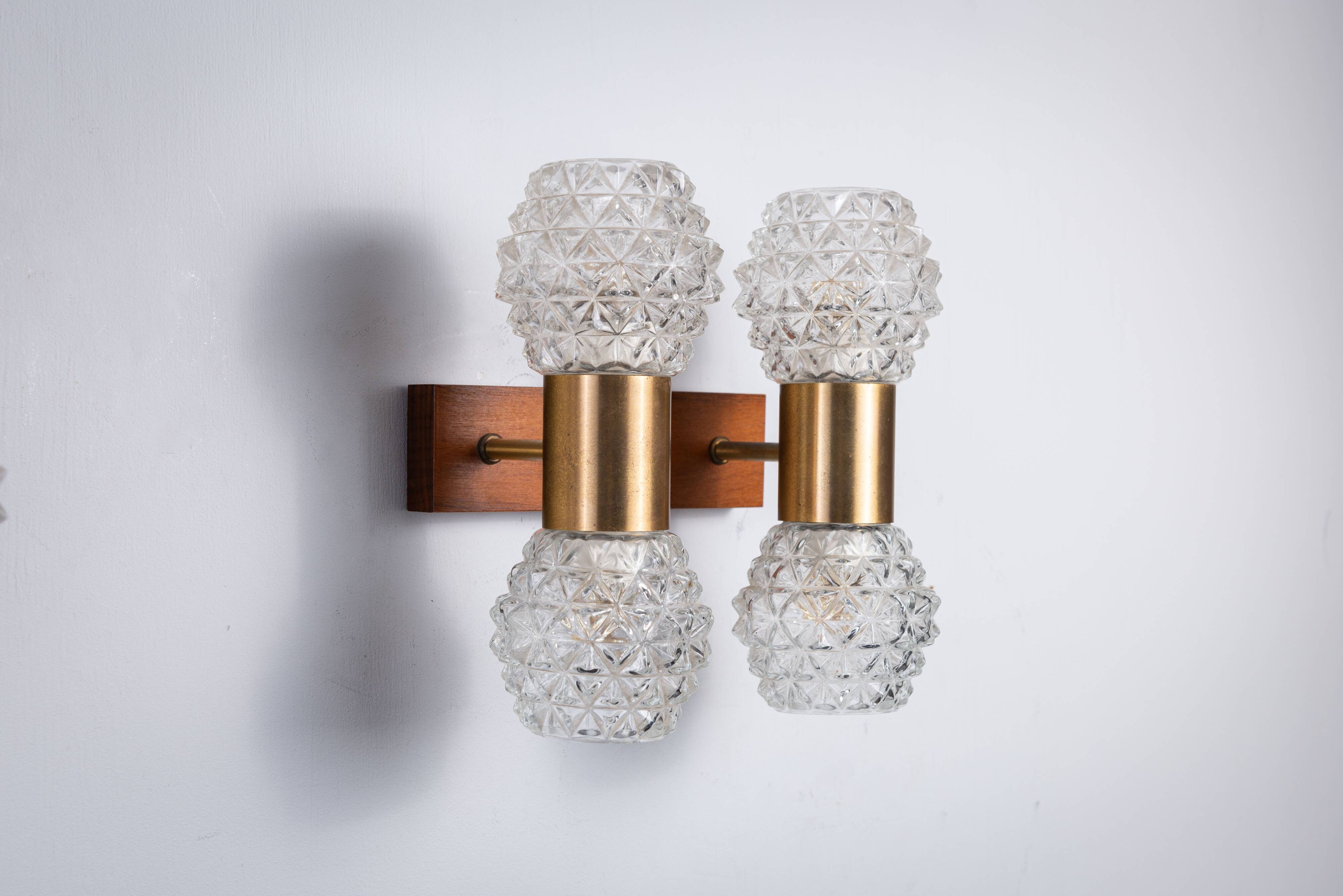 Pair of Swedish wall lamps with teak wood, brass and glass cup shade