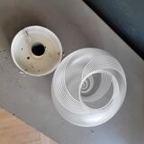 Frosted glass globe ceiling light with spiral patterns.