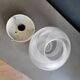 Frosted glass globe ceiling light with spiral patterns.