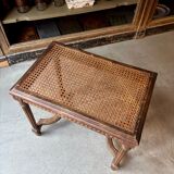 Stool, small wooden piano bench with carved details and caning.