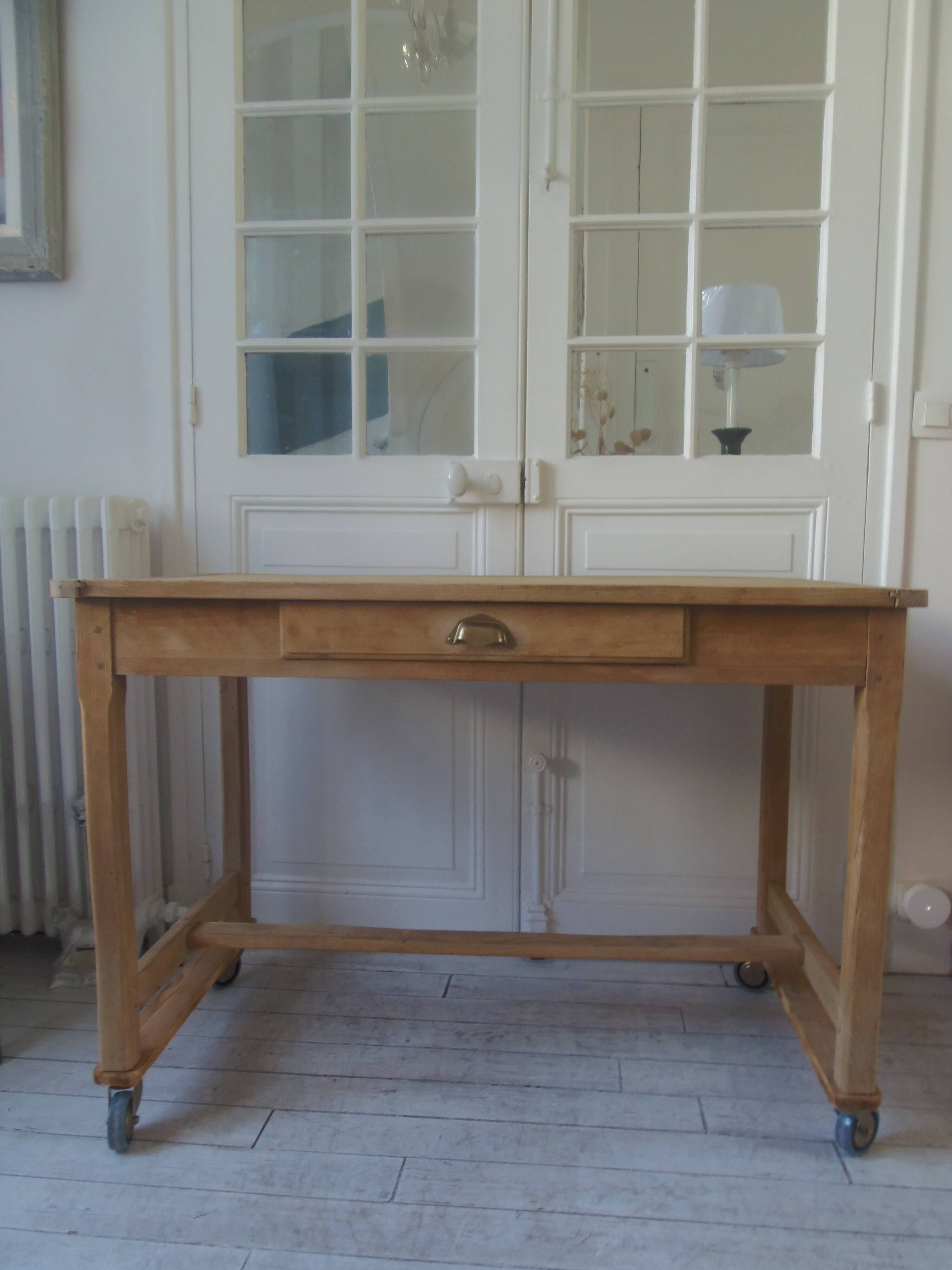 Vintage kitchen table on casters.