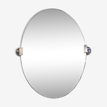 Miroir biseauté ovale et ses fixations en métal argenté 44x60cm