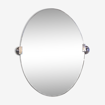 Large oval bevelled mirror and silver metal fasteners 44x60cm