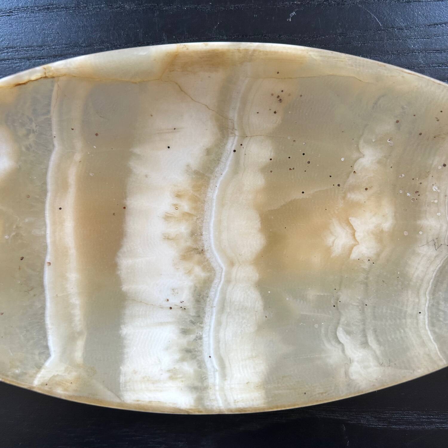 Oval onyx pocket emptier