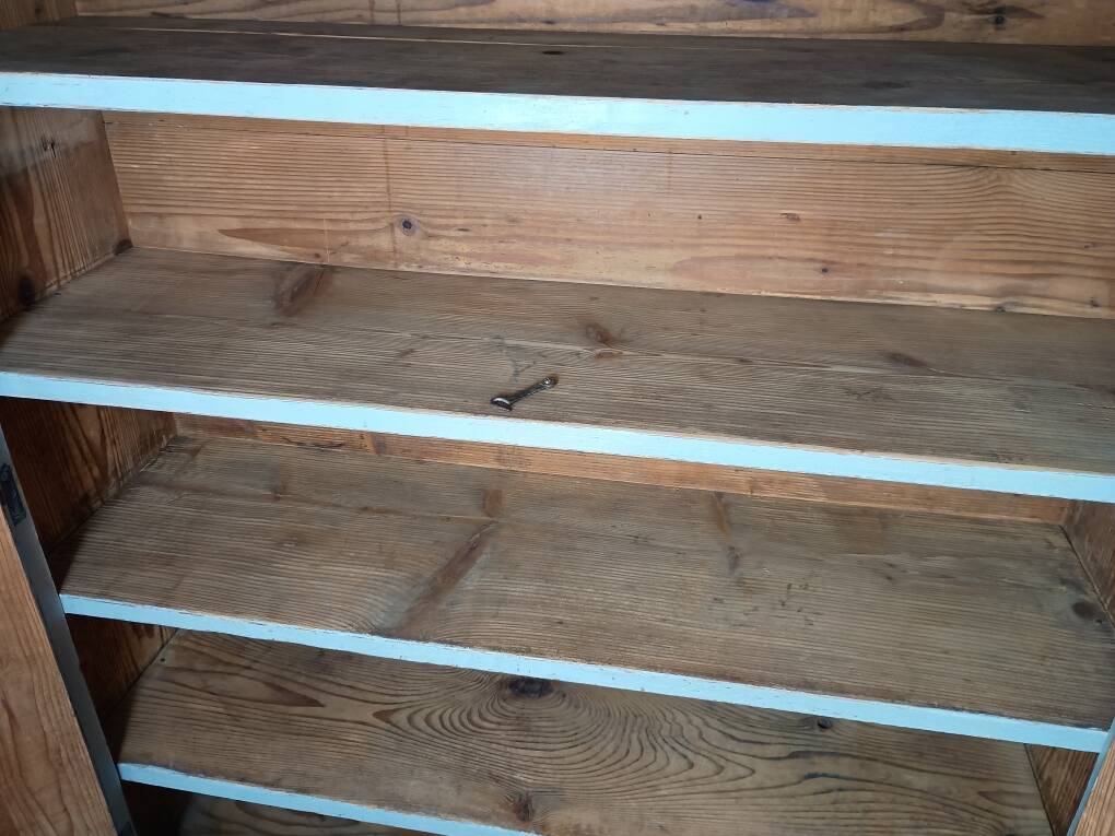 Low Parisian wardrobe with two doors, made of fir with original patina