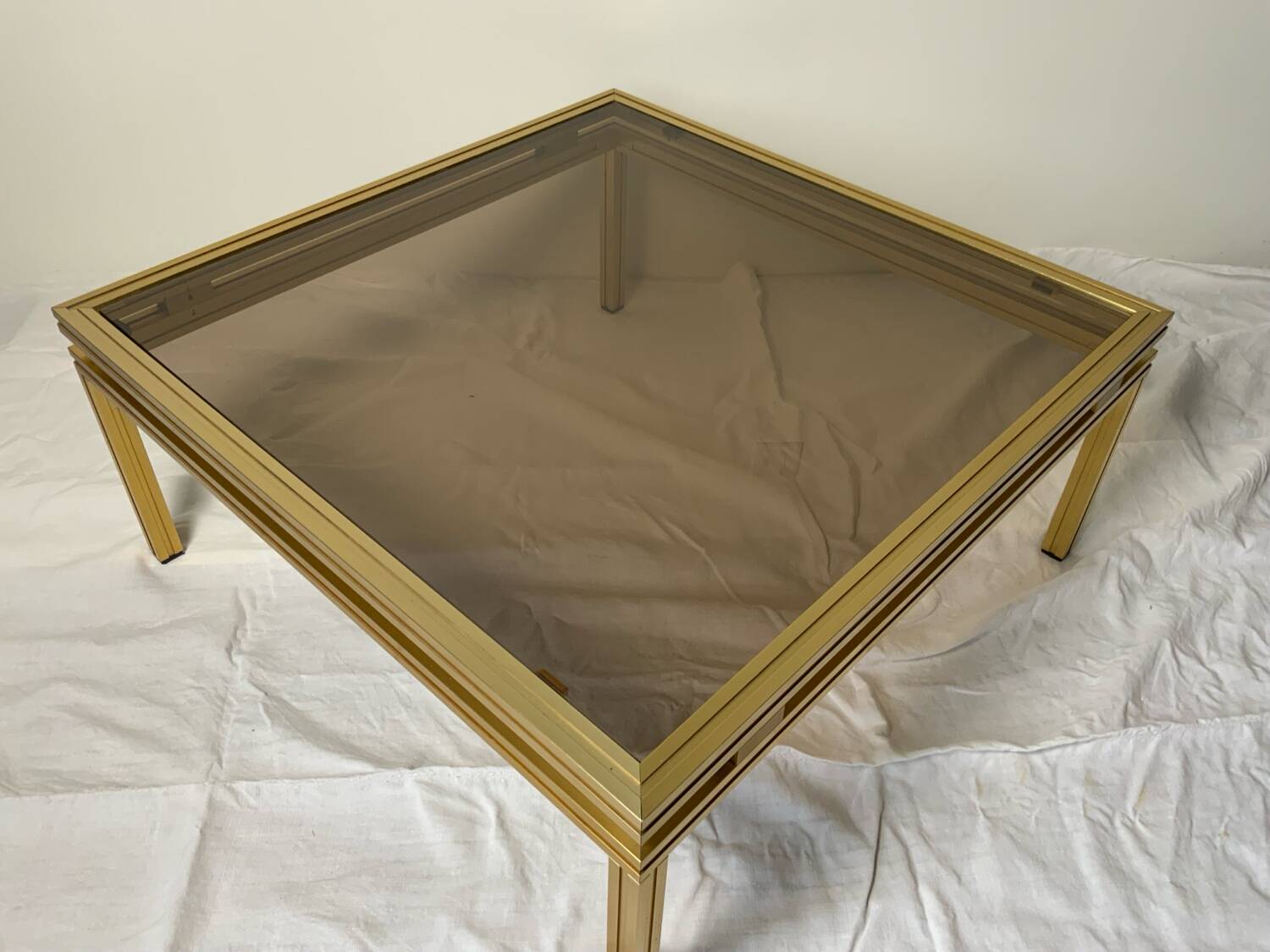 Glass and brass coffee table