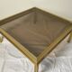 Glass and brass coffee table