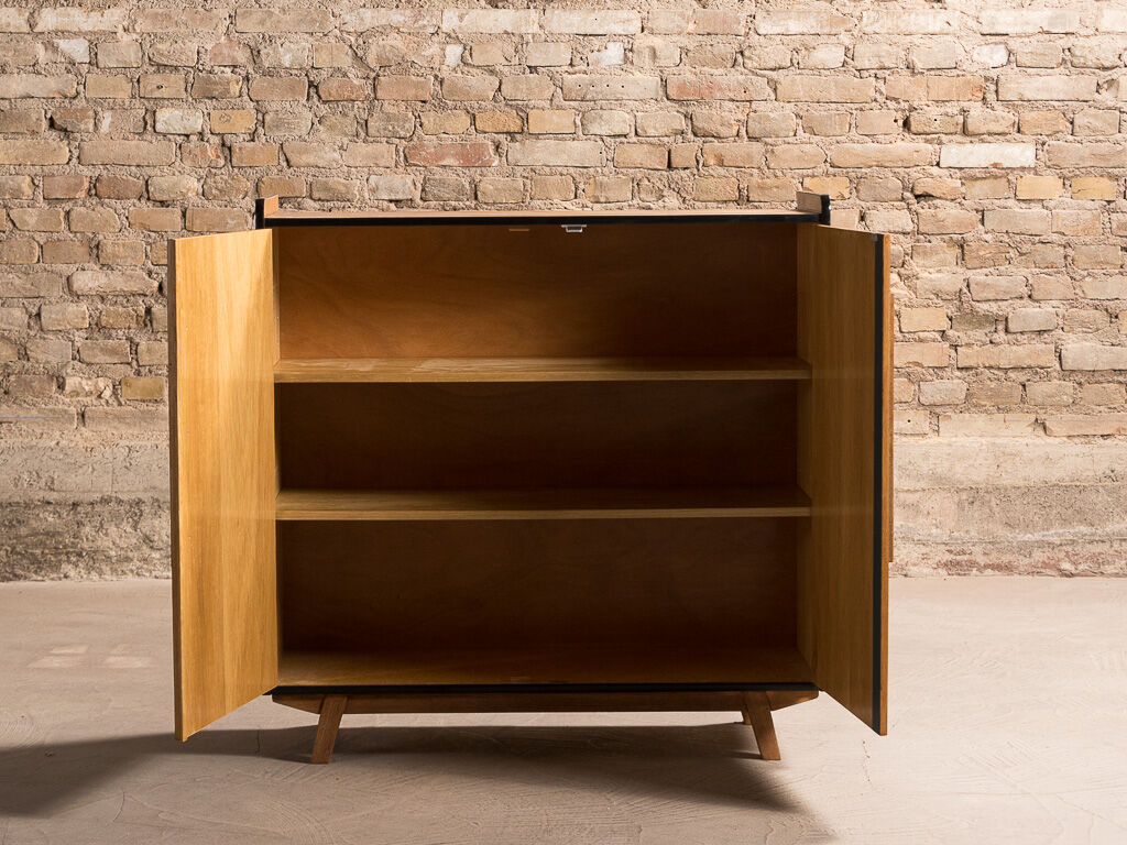 Vintage low sideboard restyled in blue with 2 swing doors and wooden base
