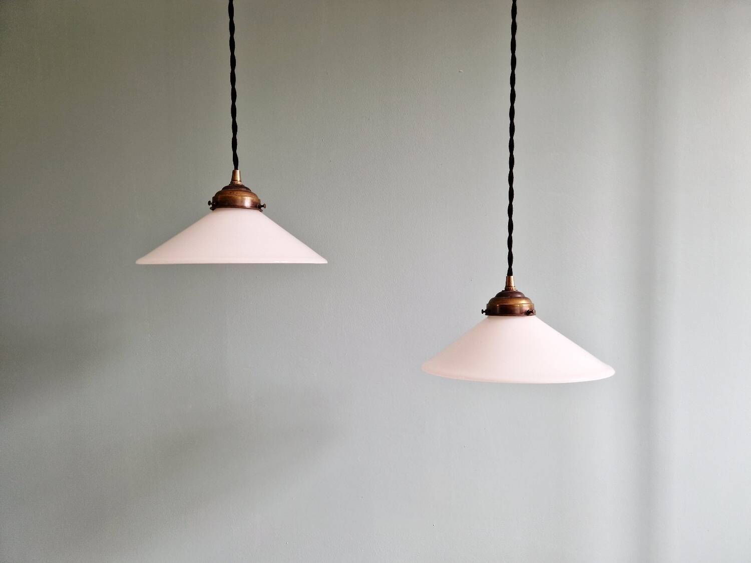 Pair of Art Deco conical white opaline pendants, 1920-30.