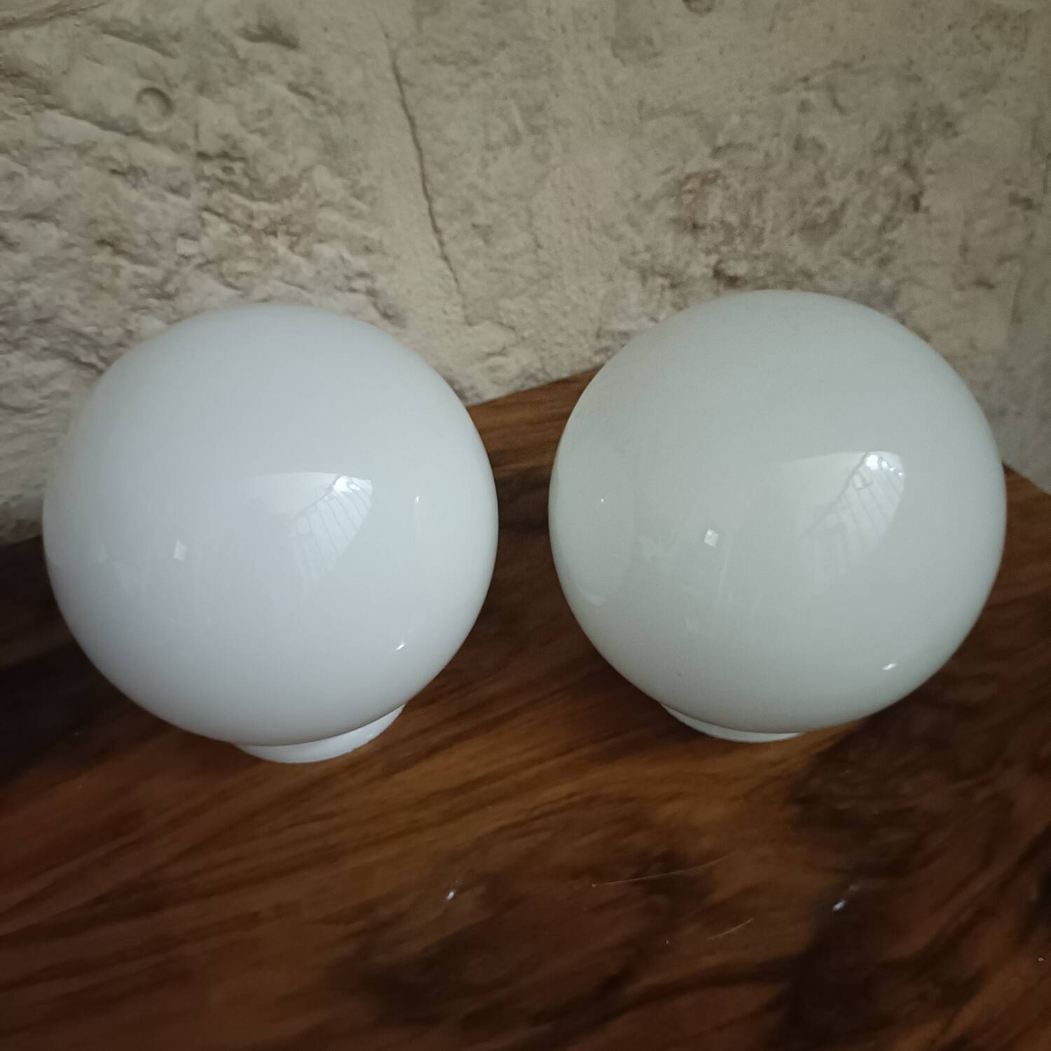 Pair of spherical lampshades in opaline.