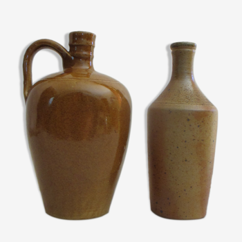 Set of two enamelled stoneware bottles.