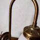 Brass wall lamp with pale pink bell