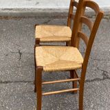 2 solid wood and straw chairs