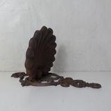 Old cast iron planter shell-shaped plant support