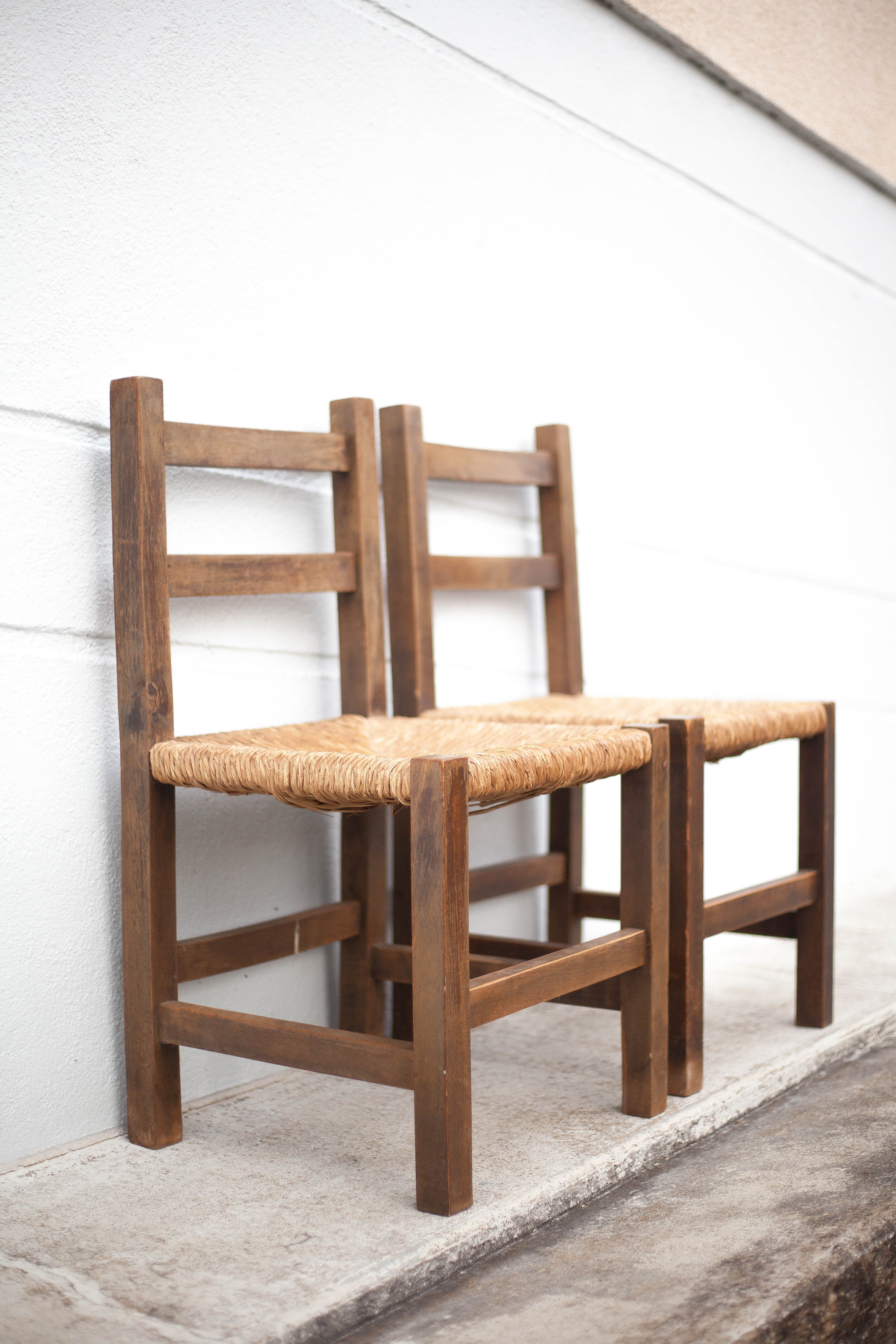 Pair of wooden and straw chairs