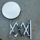 Telescopic magnifying mirror