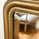 Miroir Louis Philippe perlé doré sculpté 74x98cm