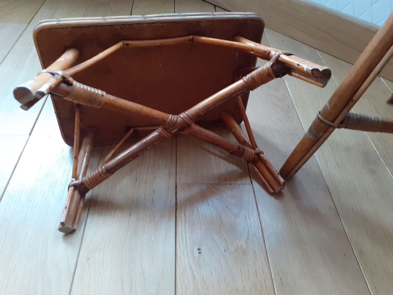 Rattan table and its small bench