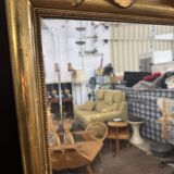 Large mirror with a gold frame