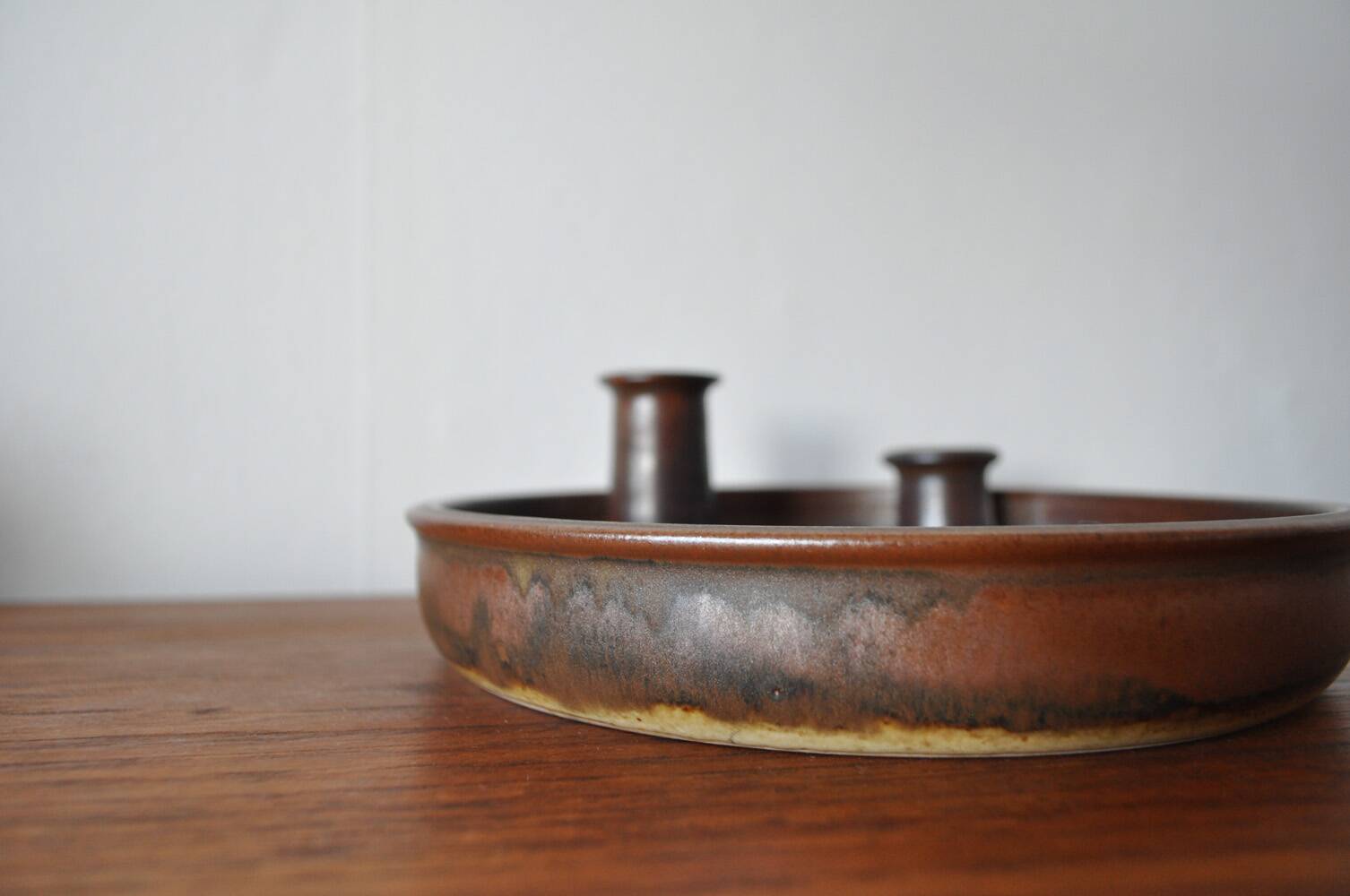 Candle holder made of stoneware with a harefur glaze