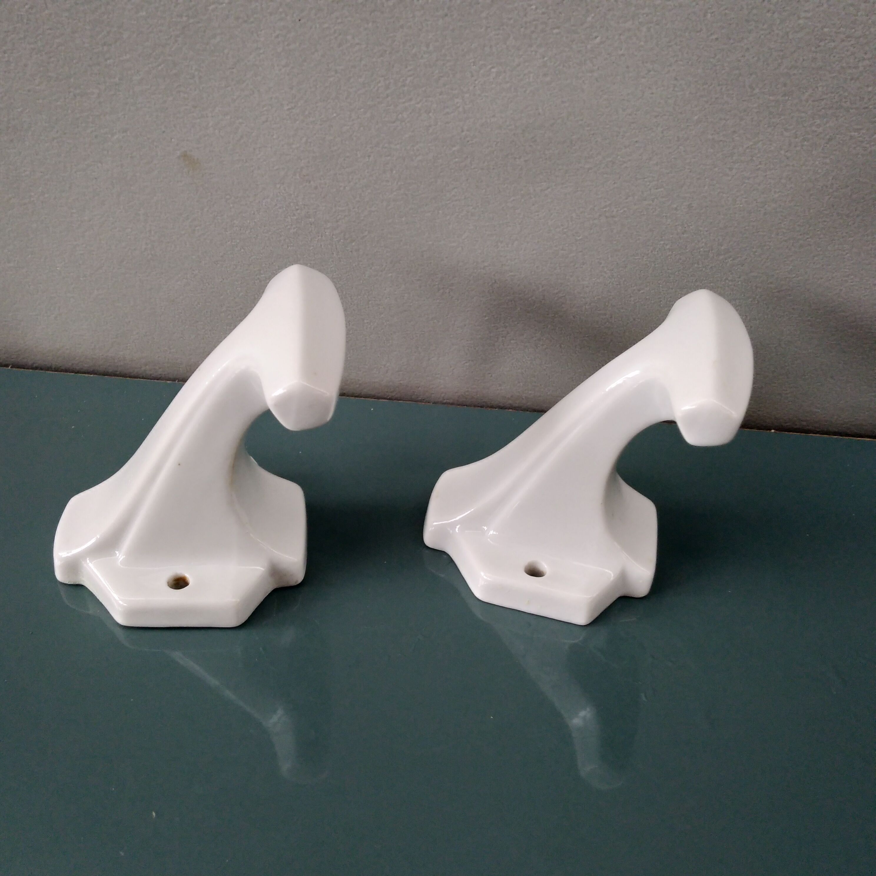 Pair of art deco porcelain coat racks