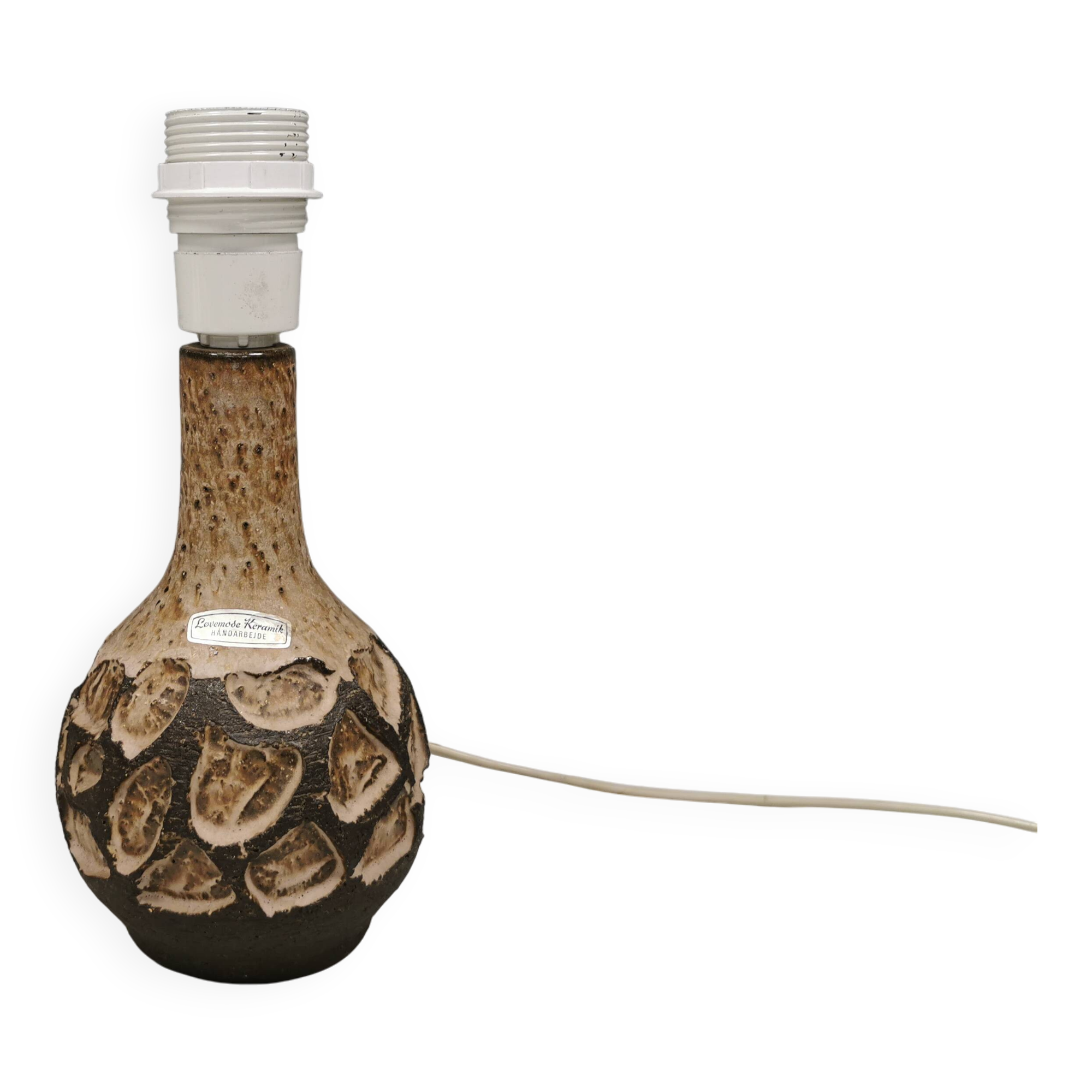 Small beautiful ceramic table lamp in earth colors.