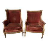 Two Louis XVI style wing chairs in gilded wood, 20th century