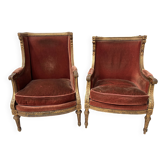 Two Louis XVI style wing chairs in gilded wood, 20th century