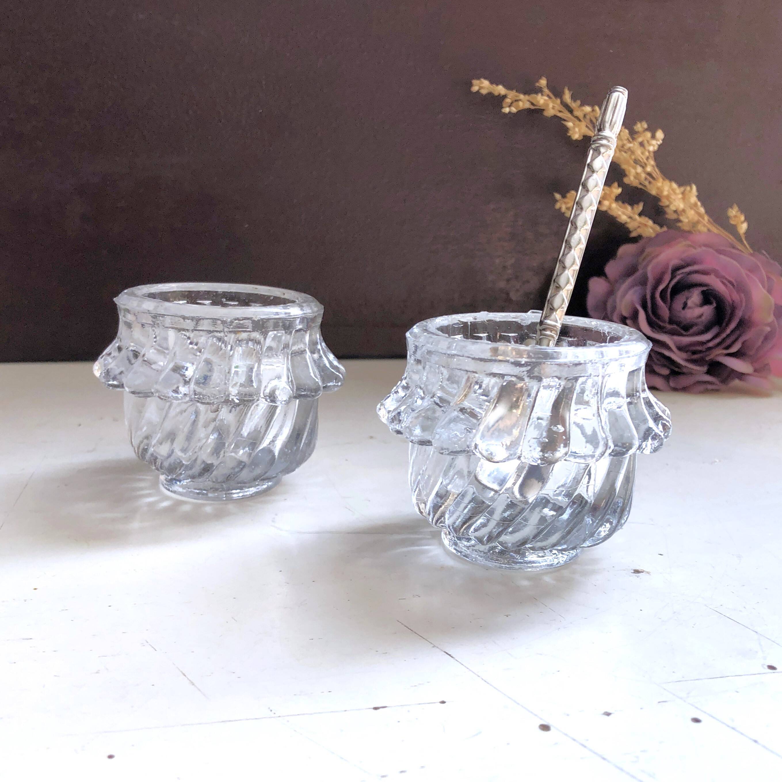 Glass salt and pepper shaker set with vintage serving spoon