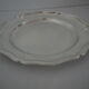 Round plate, Chinon collection with gold trim, Christofle, and its protective felt pouch.
