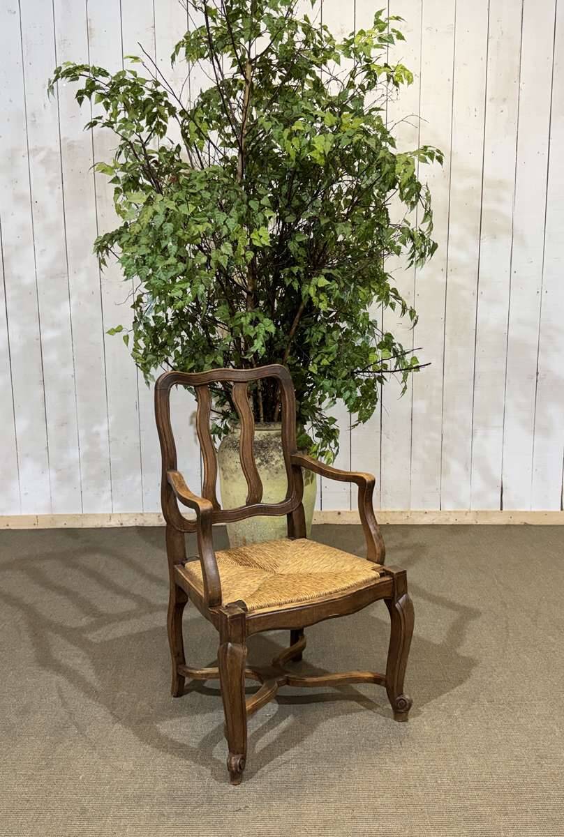 20th-century armchair in beech with a straw seat in Louis XV style.